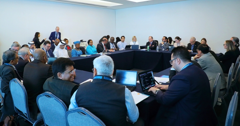 WTO Ministerial Conference in Abu Dhabi, photo of a small group meeting on agriculture, with about 30 delegates at desks arranged in a square